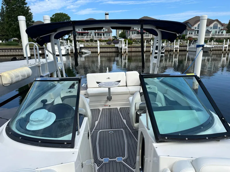 Slide: The Image of 2014 Monterey 268 Super Sport boat docked at a marina with clear skies. - 20