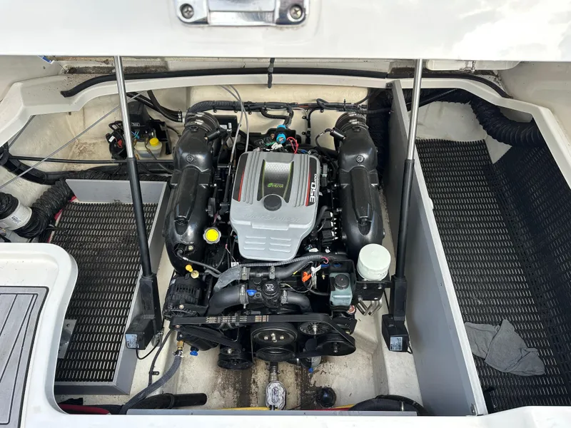 Slide: The Image of Engine compartment of a 2014 Monterey 268 Super Sport boat, showcasing detailed components. - 25