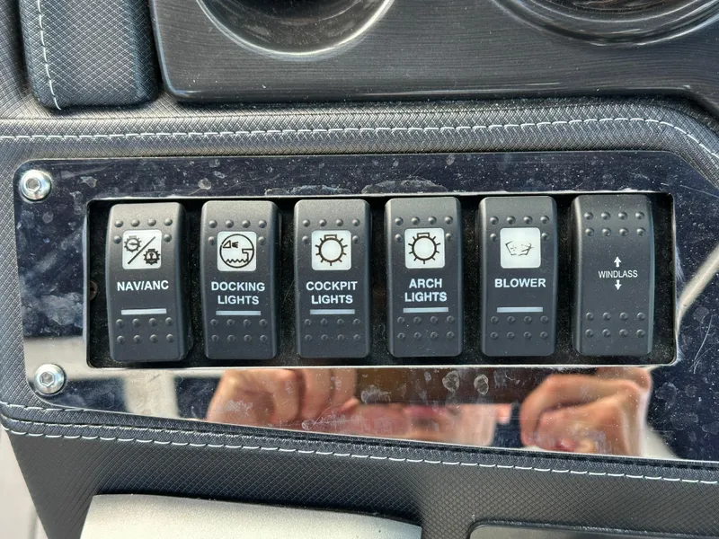 Slide: The Image of Control panel of a 2014 Monterey 268 Super Sport boat with labeled switches. - 31