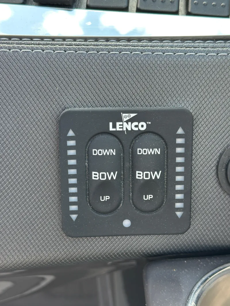 Slide: The Image of Lenco trim tab control panel on 2014 Monterey 268 Super Sport boat. - 32