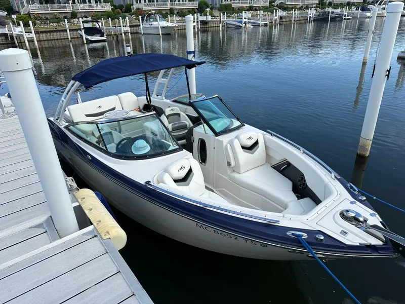 Slide: The Image of 2014 Monterey 268 Super Sport boat docked at marina with blue canopy. - 4