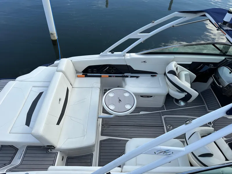 Slide: The Image of 2014 Monterey 268 Super Sport boat interior with white seating and sleek design. - 7