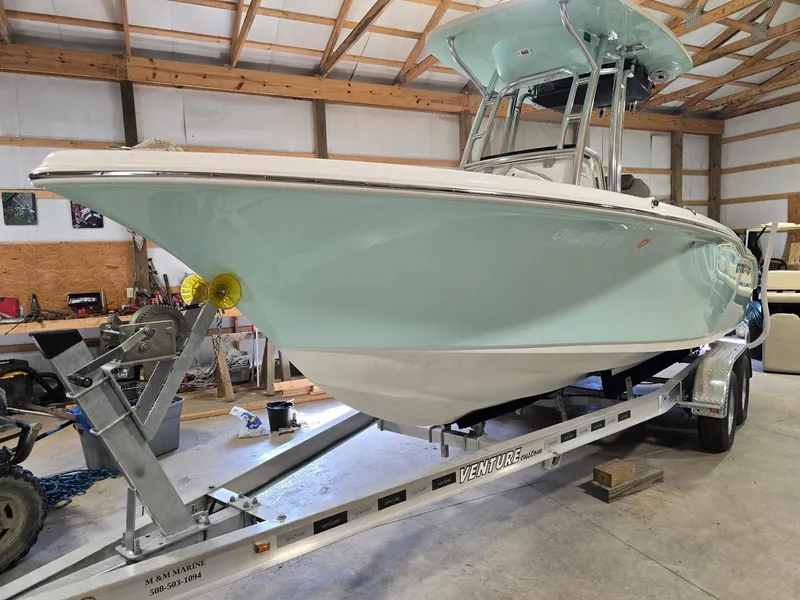 The Image of 2023 Key West 219 FS boat on trailer in a garage setting. - 0