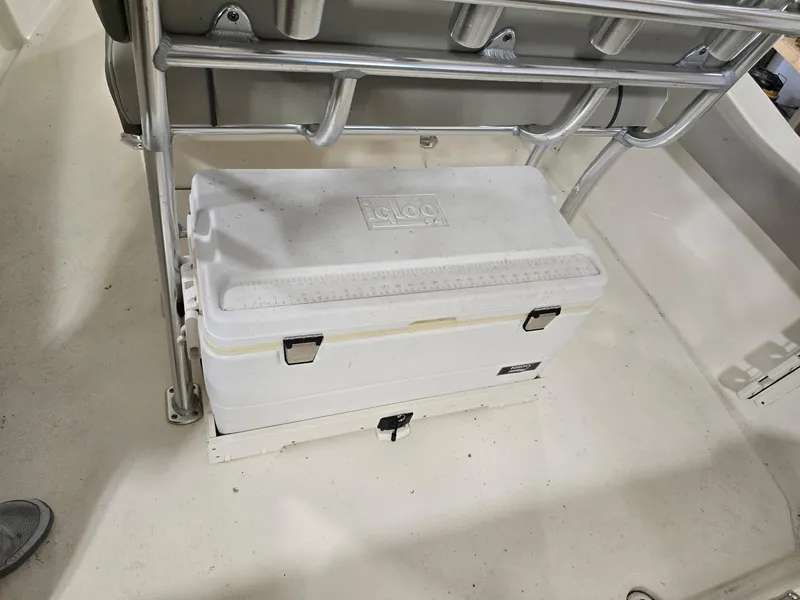 Slide: The Image of White cooler under metal frame on 2023 Key West 219 FS boat deck. - 10