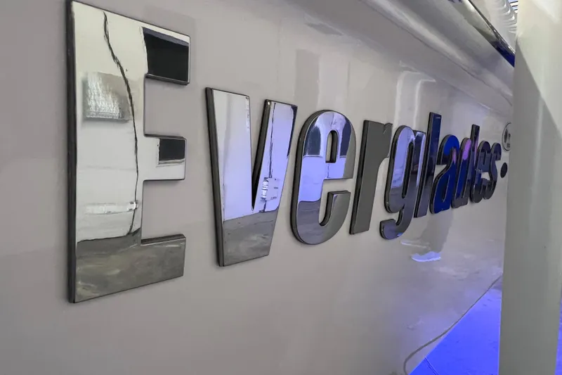 Slide: The Image of Everglades 253 Center Console 2021 boat logo in reflective chrome finish. - 11