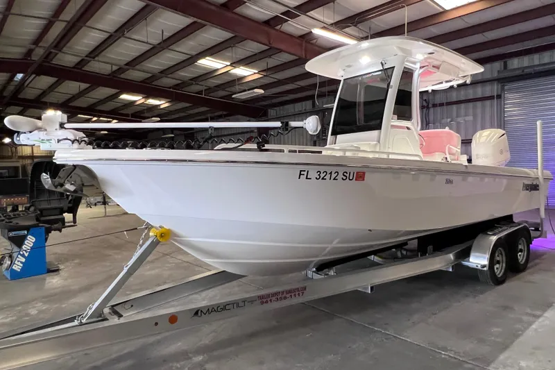 Slide: The Image of 2021 Everglades 253 Center Console boat on trailer in indoor storage facility. - 13