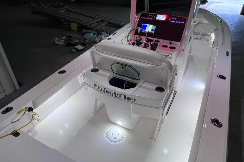 Slide: The Image of 2021 Everglades 253 Center Console boat interior with illuminated deck and advanced controls. - 15