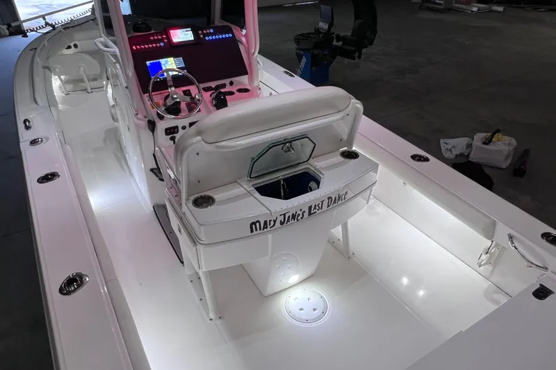Slide: The Image of 2021 Everglades 253 Center Console boat interior with illuminated deck and modern controls. - 16