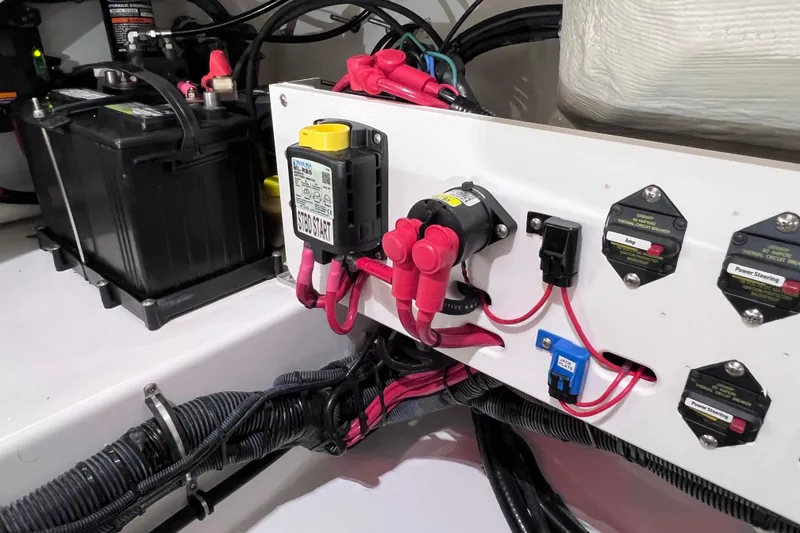 Slide: The Image of Electrical system of a 2021 Everglades 253 Center Console boat, featuring battery and wiring components. - 25