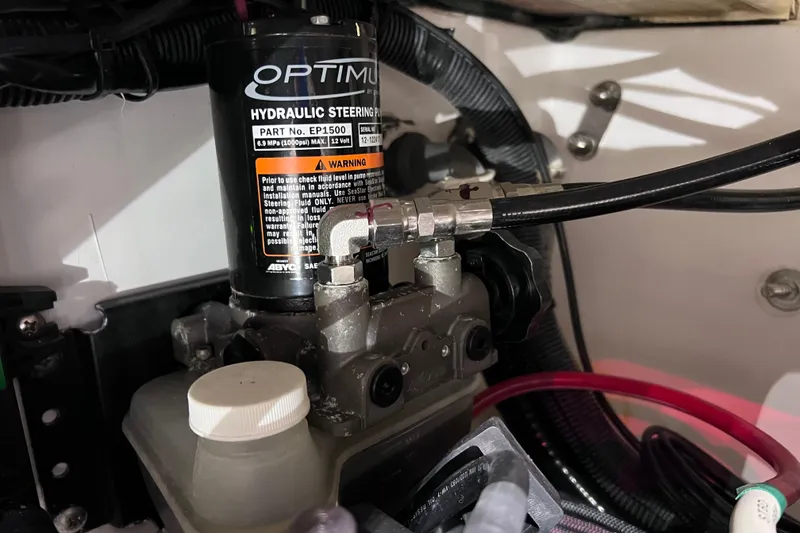 Slide: The Image of Hydraulic steering pump in 2021 Everglades 253 Center Console boat, featuring Optimum EP1500. - 27
