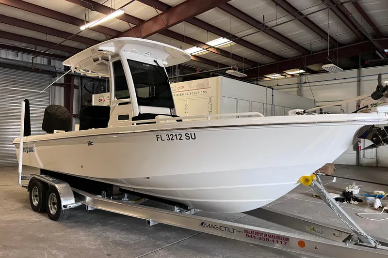 Slide: The Image of 2021 Everglades 253 Center Console boat on trailer in indoor storage facility. - 3
