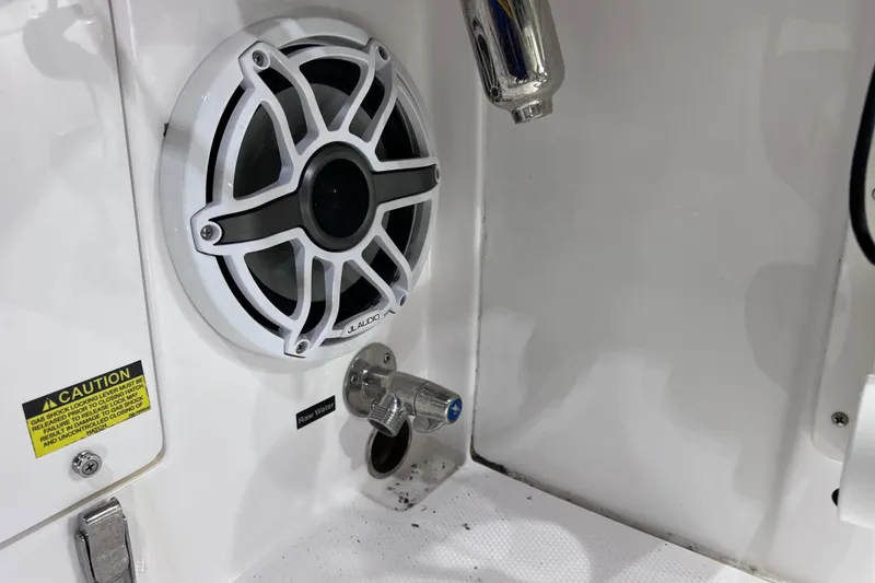 Slide: The Image of Speaker and raw water outlet on 2021 Everglades 253 Center Console boat. - 30