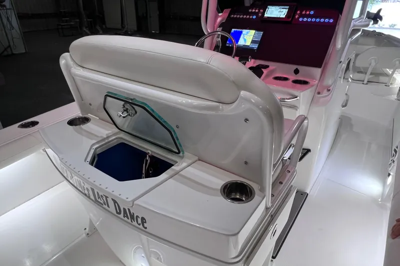 Slide: The Image of 2021 Everglades 253 Center Console boat interior with control panel and seating. - 31