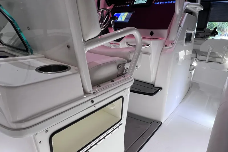 Slide: The Image of Interior of 2021 Everglades 253 Center Console boat with modern helm and seating. - 34