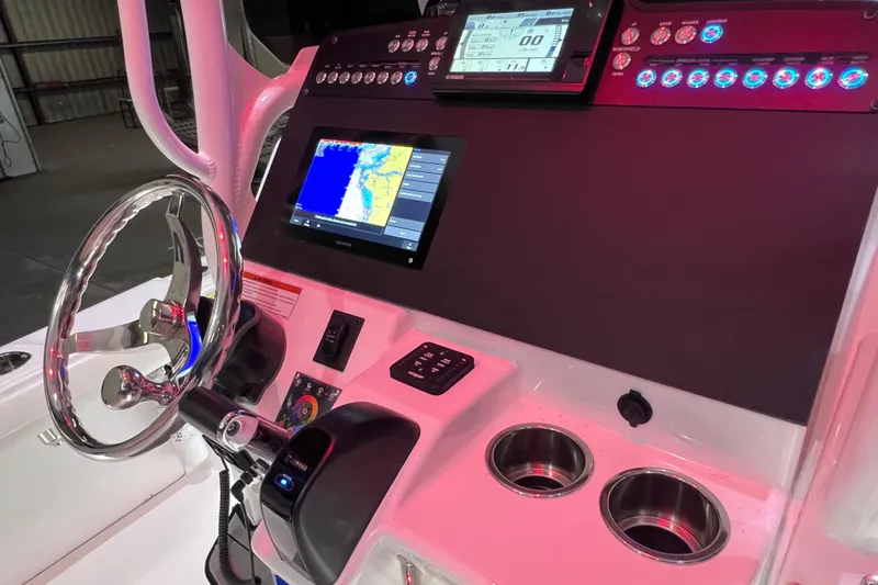 Slide: The Image of 2021 Everglades 253 Center Console dashboard with navigation screens and controls. - 41