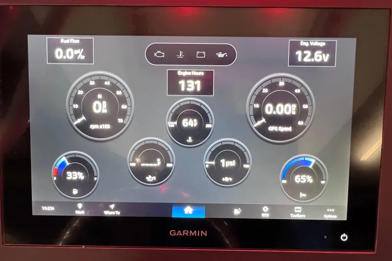 Slide: The Image of Garmin display on 2021 Everglades 253 Center Console showing engine metrics and fuel data. - 45