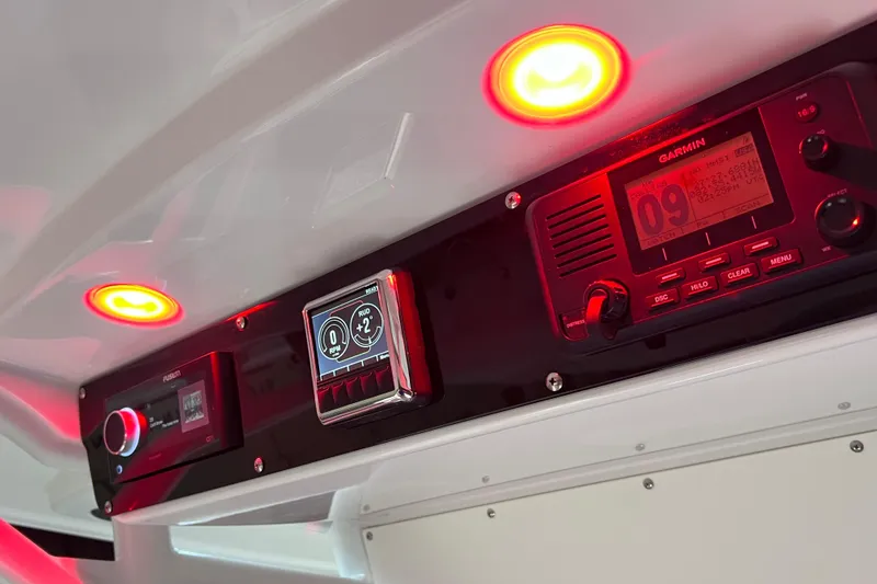 Slide: The Image of Control panel of 2021 Everglades 253 Center Console with red LED lights and Garmin display. - 47