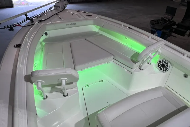 Slide: The Image of 2021 Everglades 253 Center Console boat interior with green LED lighting. - 49