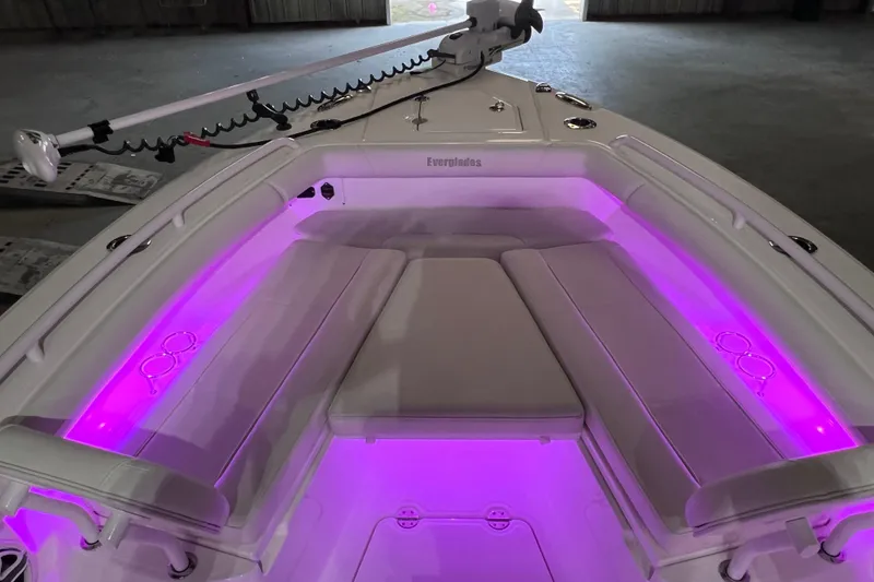 Slide: The Image of 2021 Everglades 253 Center Console boat with purple LED interior lighting. - 53