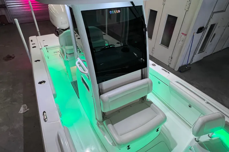 Slide: The Image of 2021 Everglades 253 Center Console boat with illuminated deck and seating. - 58