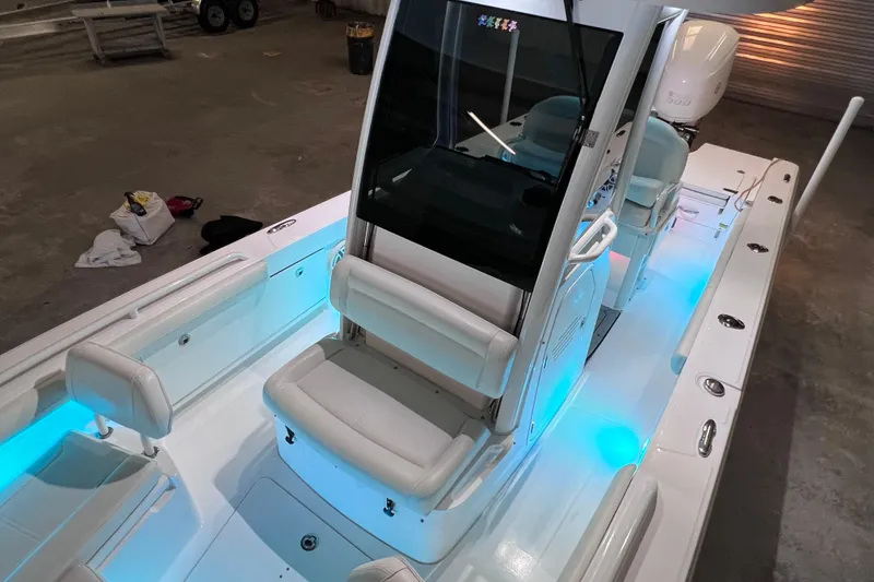 Slide: The Image of 2021 Everglades 253 Center Console boat with illuminated interior and sleek design. - 59