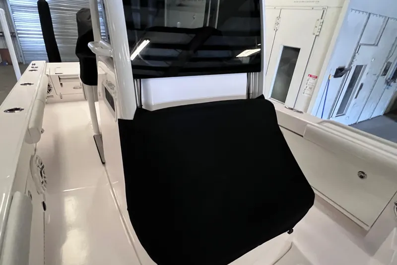 Slide: The Image of 2021 Everglades 253 Center Console interior with covered console and seating. - 6