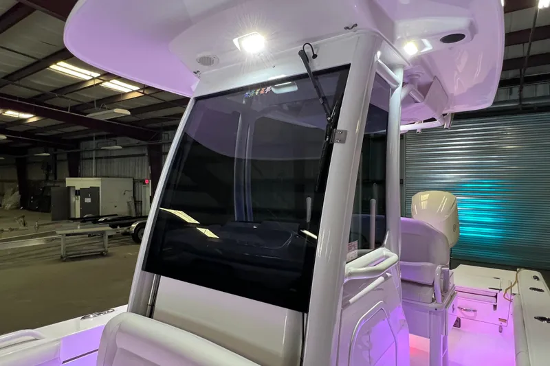 Slide: The Image of 2021 Everglades 253 Center Console boat interior with modern design and lighting. - 61