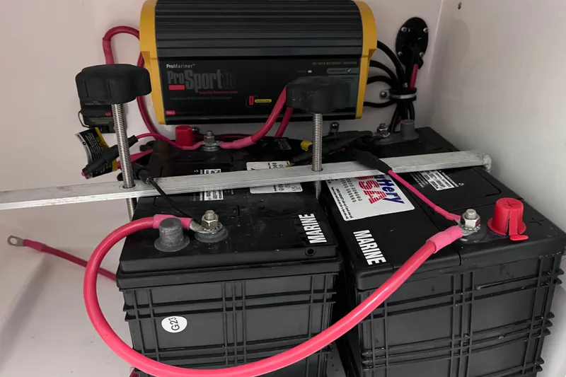 Slide: The Image of Marine batteries and charger in 2021 Everglades 253 Center Console boat. - 72