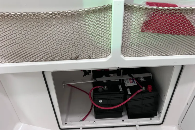 Slide: The Image of Battery compartment of 2021 Everglades 253 Center Console boat with marine batteries. - 73