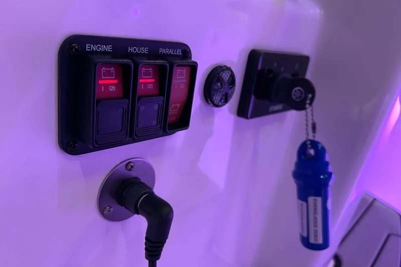 Slide: The Image of Control panel on 2021 Everglades 253 Center Console boat with engine and battery switches. - 75