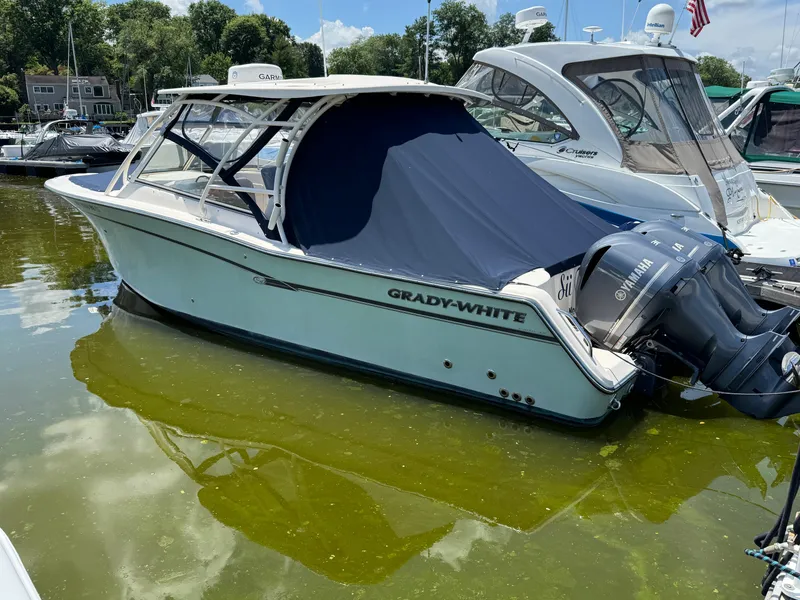 Slide: The Image of 2018 Grady-White Freedom 307 boat docked with Yamaha engines. - 1