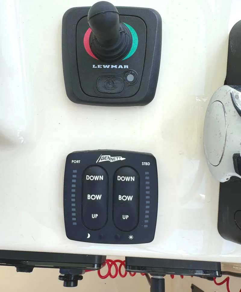 Slide: The Image of Control panel of a 2018 Grady-White Freedom 307 boat with Lewmar and Bennett switches. - 11