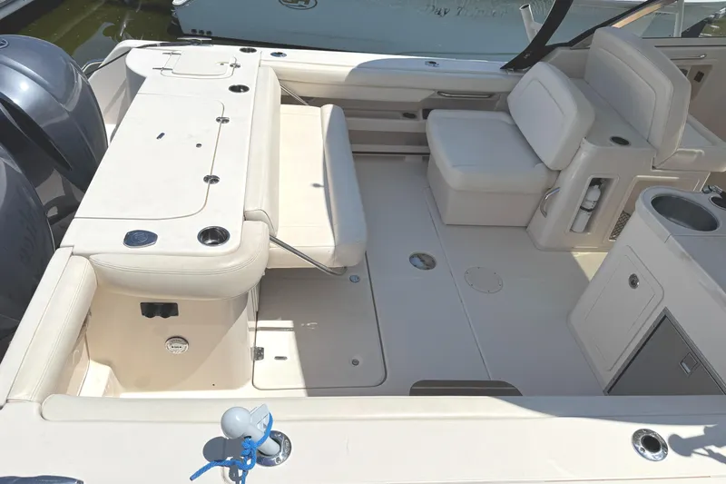 Slide: The Image of 2018 Grady-White Freedom 307 boat interior with seating and storage compartments. - 20