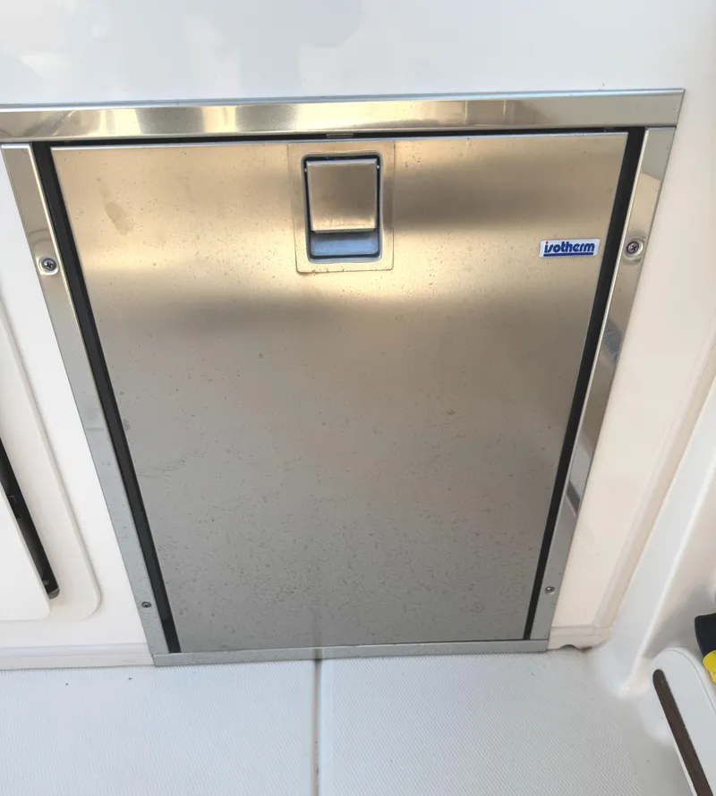 Slide: The Image of Stainless steel door on 2018 Grady-White Freedom 307 boat, featuring Isotherm branding. - 24