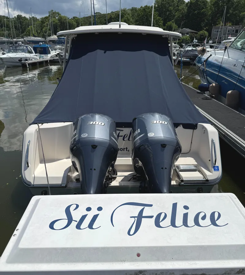 Slide: The Image of 2018 Grady-White Freedom 307 boat with twin Yamaha 300 engines docked at marina. - 3