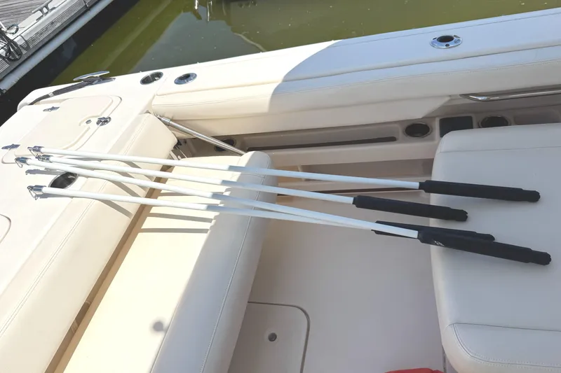 Slide: The Image of 2018 Grady-White Freedom 307 boat interior with fishing rod holders. - 41