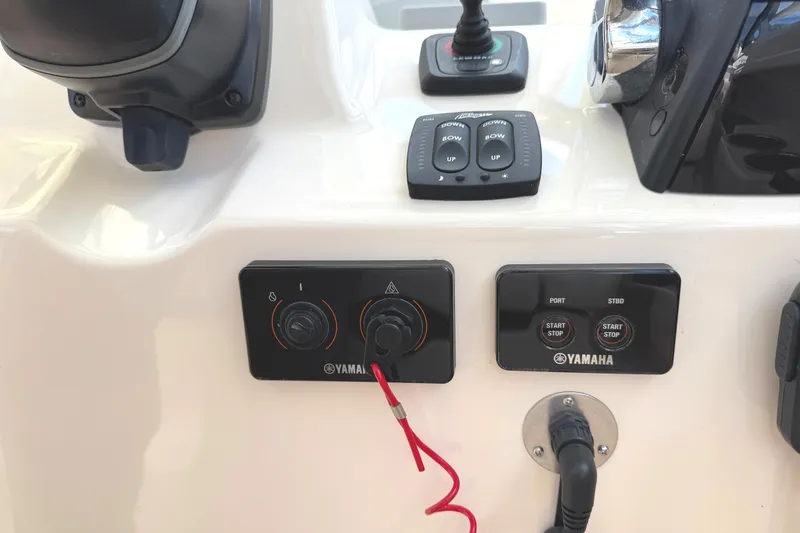 Slide: The Image of Control panel of a 2018 Grady-White Freedom 307 boat with Yamaha switches. - 7