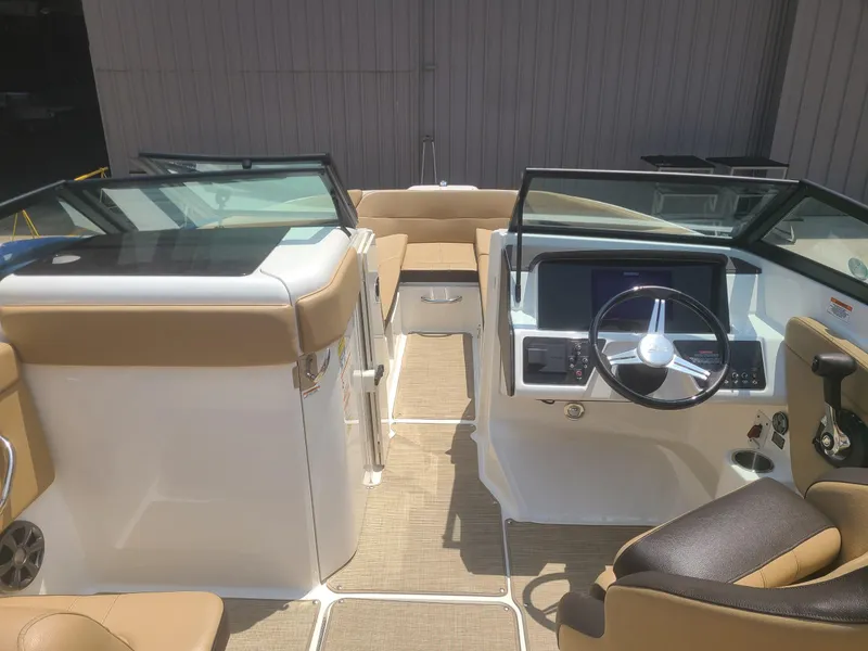 Slide: The Image of 2020 Sea Ray SPX 230 boat interior with modern dashboard and seating. - 3