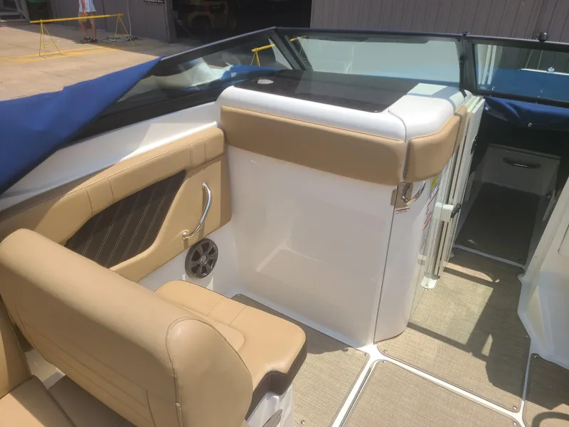 Slide: The Image of 2020 Sea Ray SPX 230 boat interior with tan seating and modern design. - 5