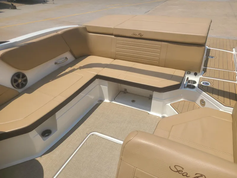 Slide: The Image of 2020 Sea Ray SPX 230 boat interior with tan seating and deck. - 7