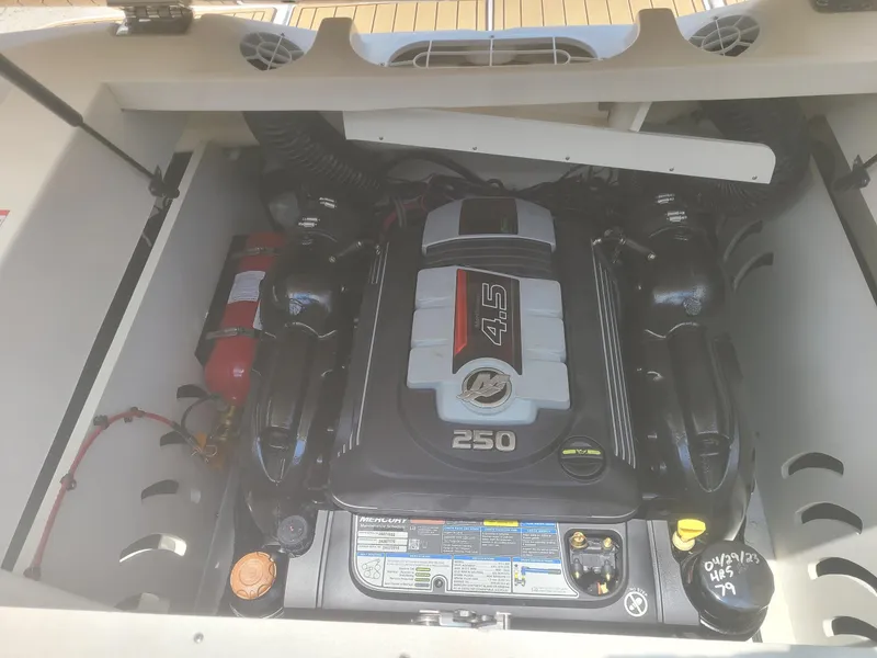 Slide: The Image of Engine compartment of a 2020 Sea Ray SPX 230 boat, featuring a 4.5L Mercury engine. - 8