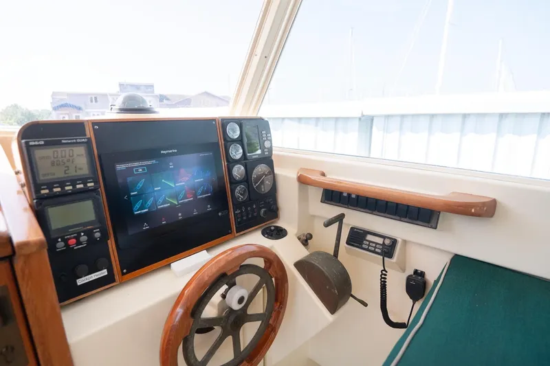 Slide: The Image of Control panel of a 1997 Belkov Picnic Express boat with navigation instruments. - 11