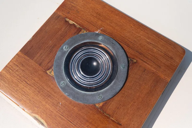 Slide: The Image of Wooden base with a circular metal and glass component, Belkov Picnic Express 1997. - 15