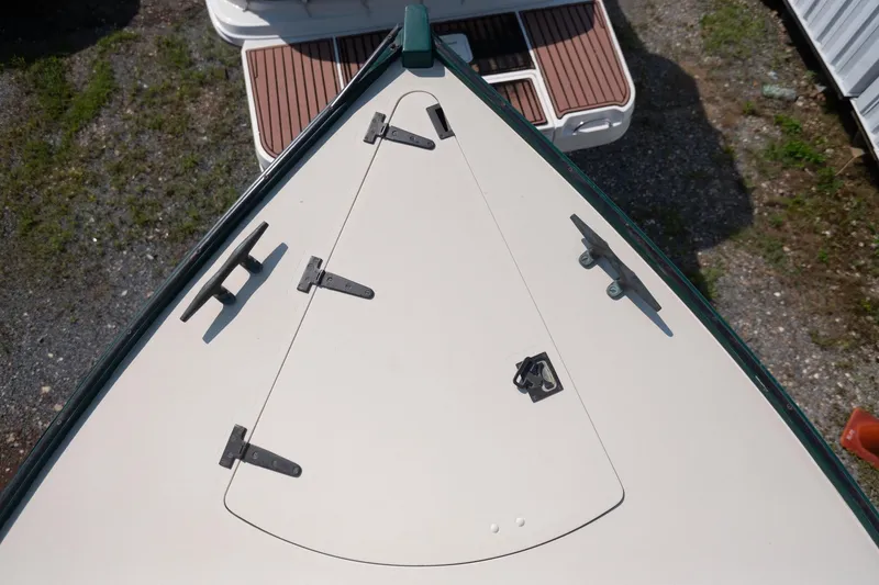 Slide: The Image of Top view of 1997 Belkov Picnic Express boat deck with cleats and hatch. - 16