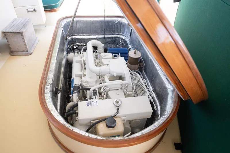 Slide: The Image of Engine compartment of a 1997 Belkov Picnic Express boat, showcasing detailed machinery. - 7