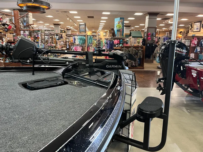 Slide: The Image of 2025 Ranger Z520R Cup-Equipped boat displayed in a store with Garmin equipment. - 5