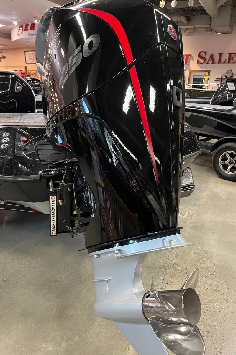 Slide: The Image of 2025 Ranger Z520R Cup-Equipped boat motor in showroom, featuring sleek black and red design. - 7