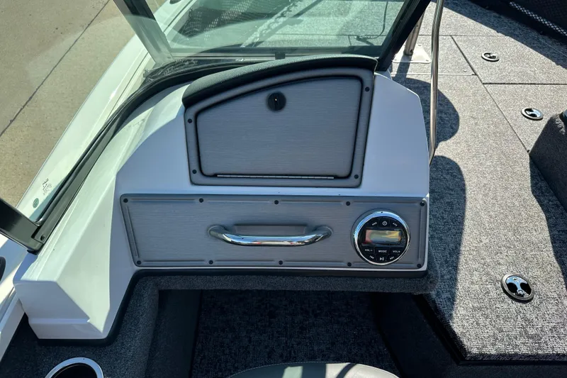 Slide: The Image of 2025 Ranger VS1882SC Angler boat dashboard with control panel and storage compartment. - 4