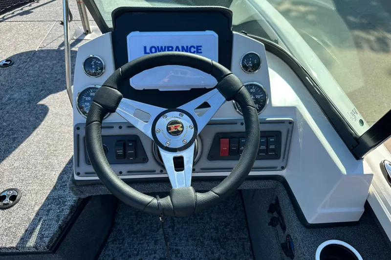 Slide: The Image of 2025 Ranger VS1882SC Angler boat dashboard with steering wheel and Lowrance display. - 5