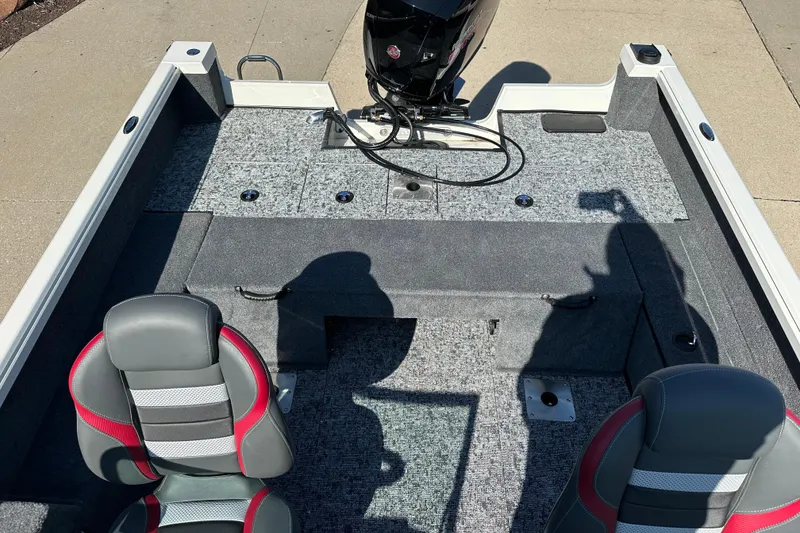 Slide: The Image of 2025 Ranger VS1882SC Angler boat interior with gray and red seating, carpeted deck. - 9